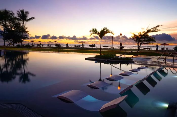 Sunset view of the pool at Sheraton Kauai Coconut Beach Resort