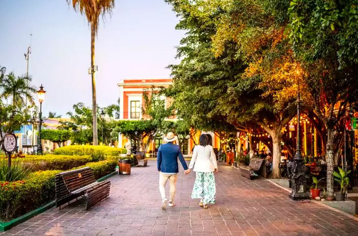 A married couple strolls through the historic district