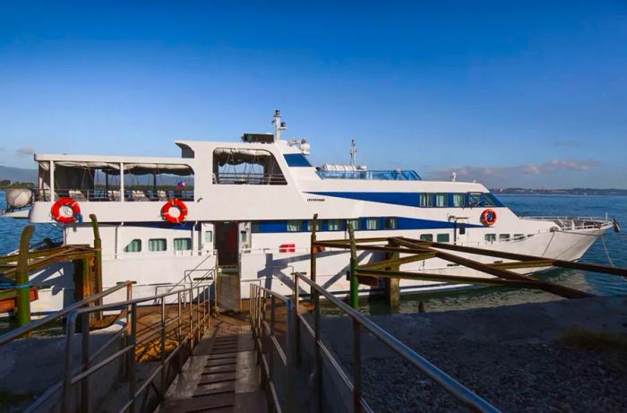 The fast ferry arrives at the pier, ready for foot passengers.