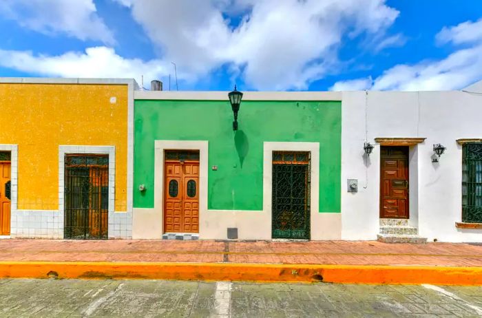 On a sunny day, the vibrant colors of colonial houses brighten the streets of Campeche, Mexico.