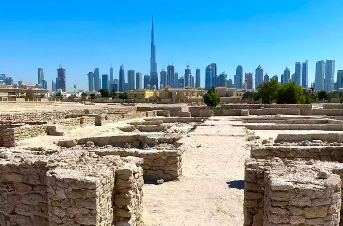 The remnants of a ninth-century city at the Jumeirah Archaeological Site, with the Dubai skyline in the background.