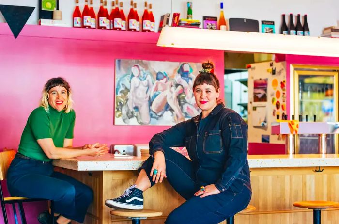 Two women enjoying their time at a bar.