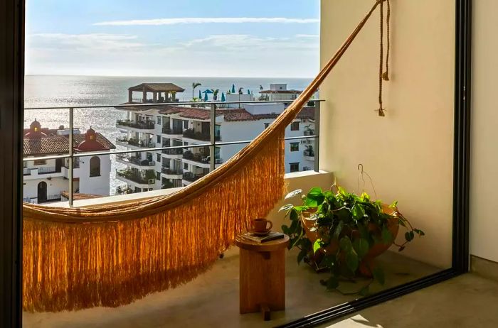 Ocean-view guest room featuring a terrace with a hammock at The Tryst Puerto Vallarta