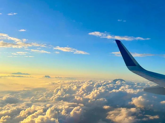 Aerial view of Mount Agung in Bali and Mount Rinjani in Lombok as seen from a morning flight