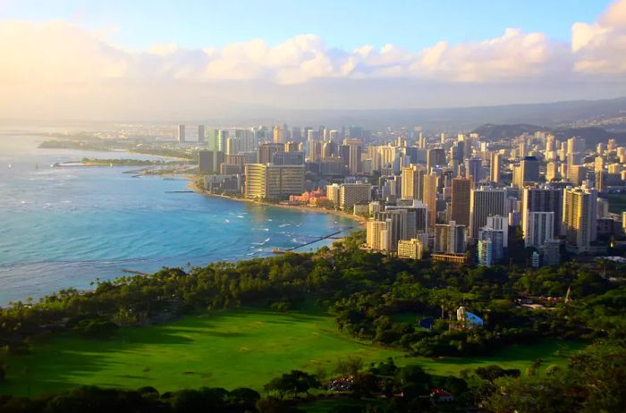 View from the peak of Diamond Head Crater, showcasing the Honolulu skyline and Waikiki Beach.