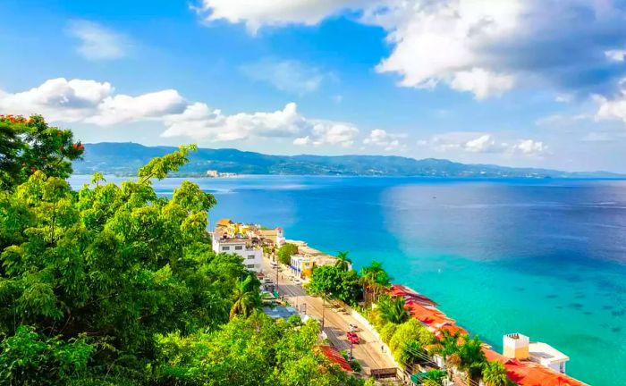 Aerial view of Jamaica's coastline with vibrant turquoise waters