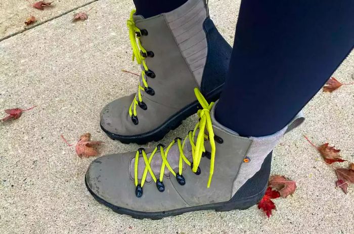 Detailed shot of Bogs Women's Holly Lace Leather Boots worn by a person