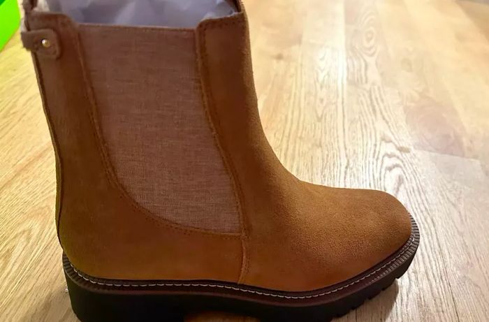 A Sam Edelman Laguna Waterproof Chelsea Boot placed on a wooden surface