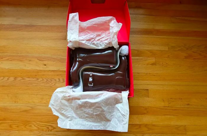 A pair of Hunter Women's Original Short Rain Boots neatly packaged in their box