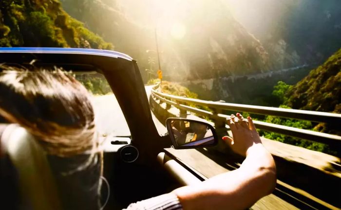 Woman enjoying the ride in a convertible