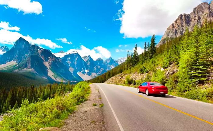 A rental car navigating a scenic mountain route