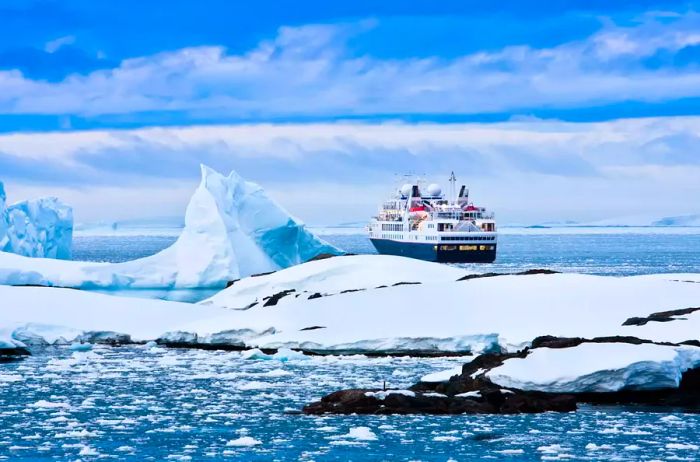 Large cruise ship navigating Antarctic waters