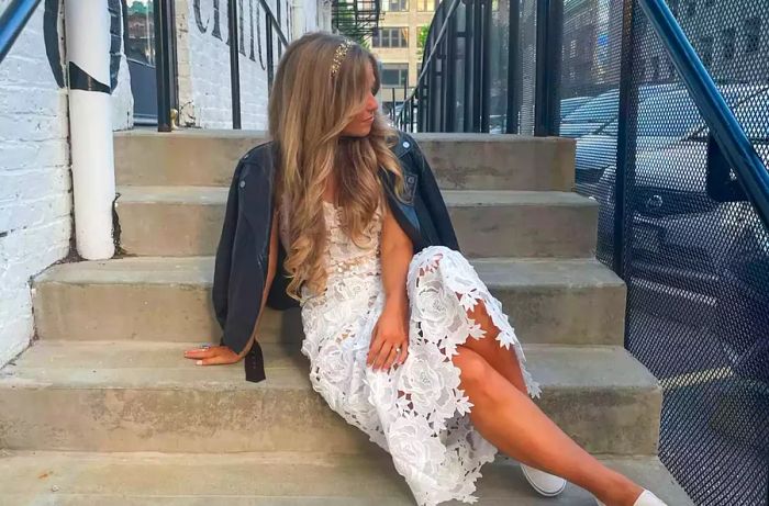 A bride perched on a step in Providence, Rhode Island