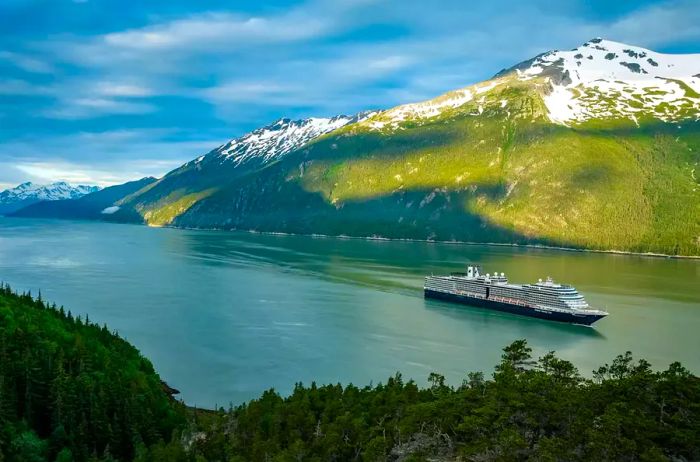 Nieuw Amsterdam cruising past mountainous landscapes