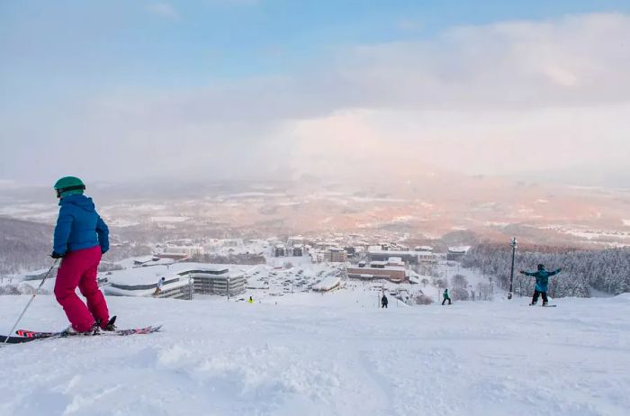 Skiing and snowboarding at Grand Hirafu Niseko, featuring stunning slopes with views of Mt. Niseko-Annupuri and Mt. Yotei.