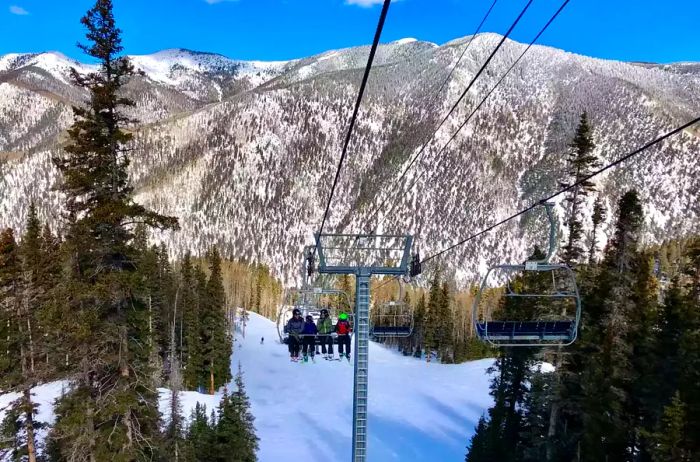 Skiing at Taos Ski Valley, New Mexico, under bright sunshine.