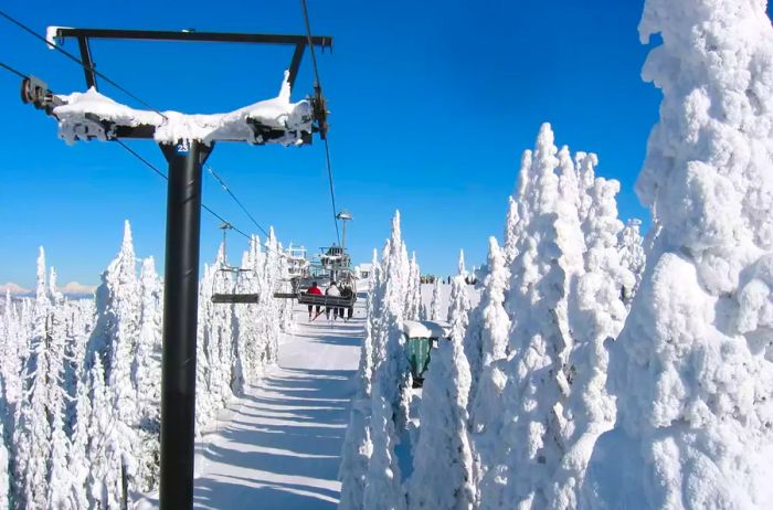 Skier enjoying a lift ride in Big Sky, Montana, following a major snowstorm