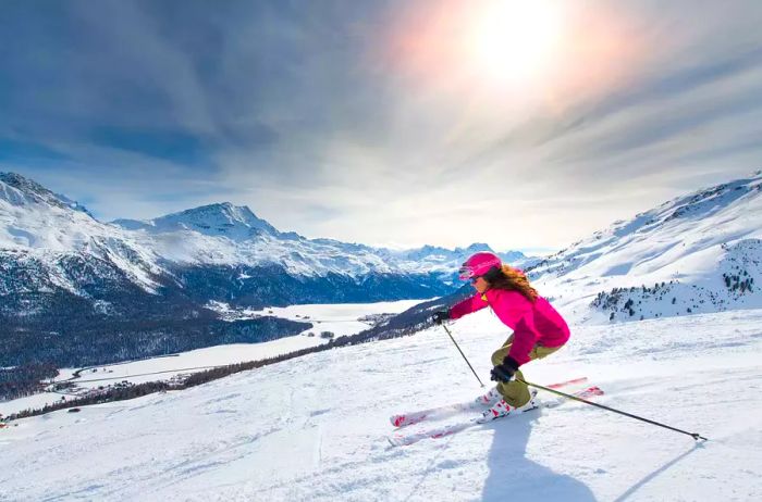 Female skier navigating a downhill slope