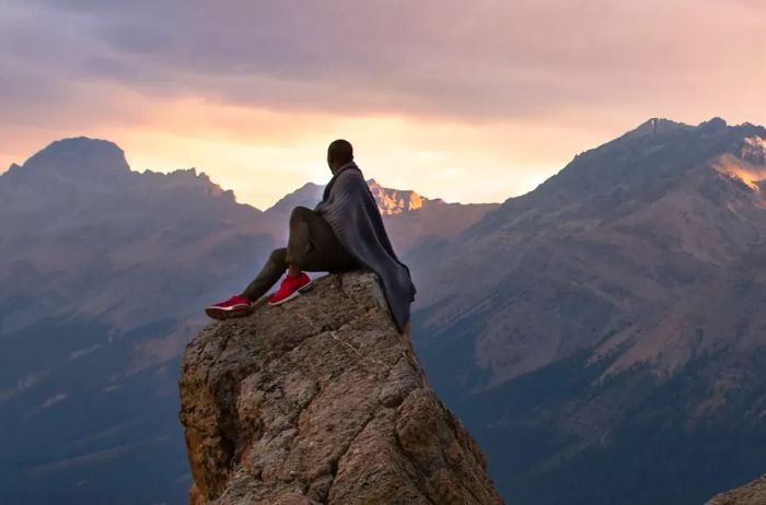 Brian McIntosh perched on a rock