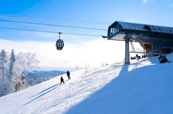 Skiers beneath a ski lift at Bretton Woods