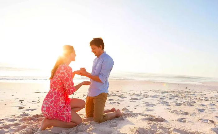 A man proposing to a woman on the beach