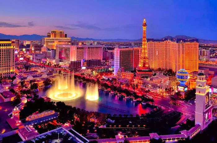 Nighttime cityscape featuring the Bellagio Hotel's iconic water fountains, Las Vegas, Nevada