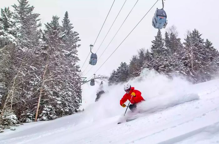 A skier beneath the ski lift at Loon Mountain