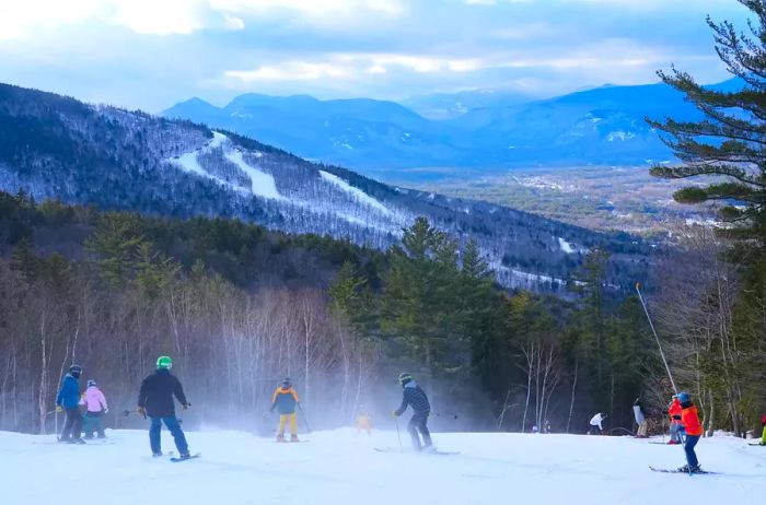 Skiers atop a ski run