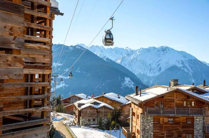 Ski lifts operating in the alpine village of Verbier during the winter season.