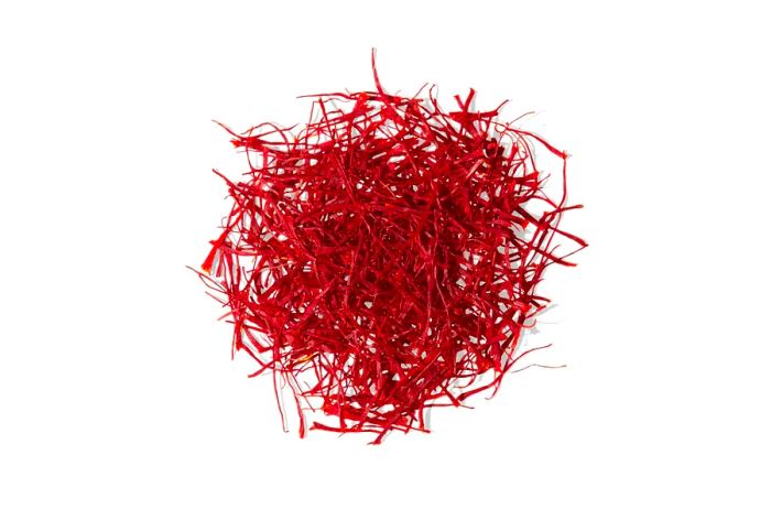 A collection of saffron threads from Moonflowers, showcased against a white background