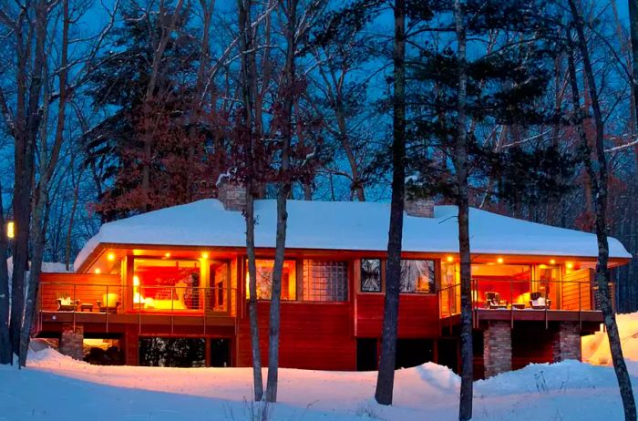 Wisconsin's Canoe Bay lodge illuminated at night