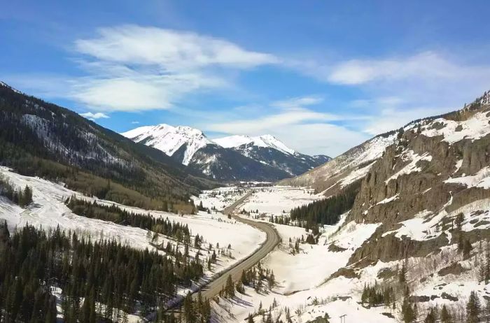 Aerial view of the Million Dollar Highway blanketed in winter snow