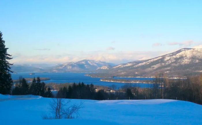 Snowy overlook featuring lakes and mountains