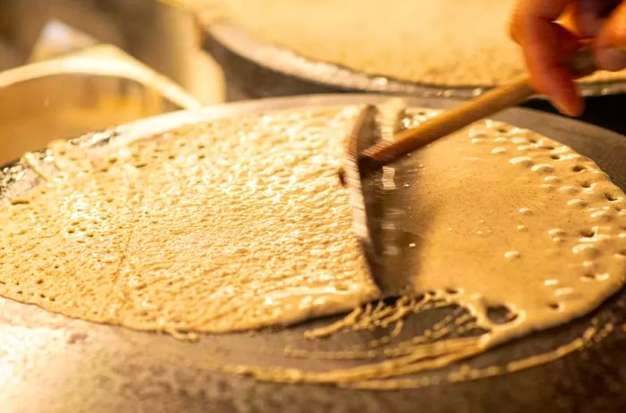 A crêpe being prepared at a cooking school in France