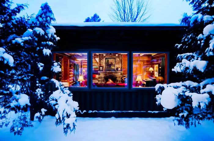 A snowy view of Lake Placid Lodge in New York