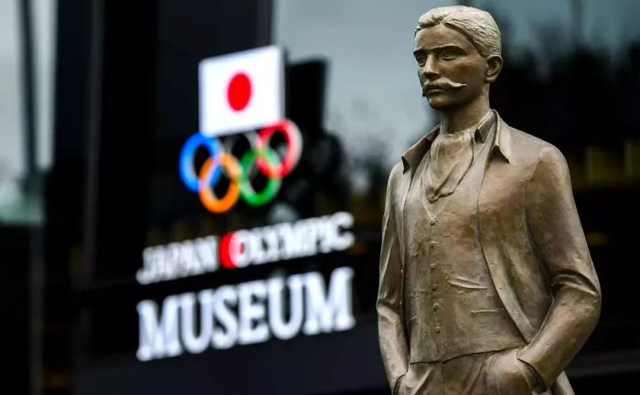 A statue honoring Pierre De Coubertin, the founder of the International Olympic Committee, stands outside the Japanese Olympic Museum and Tokyo Olympic Stadium in anticipation of the 2020 Tokyo Summer Olympics.