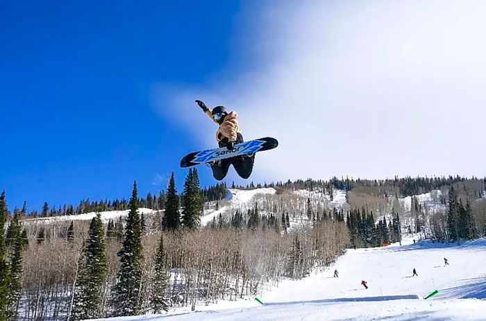 A snowboarder enjoying the slopes at Powderhorn Mountain Resort.