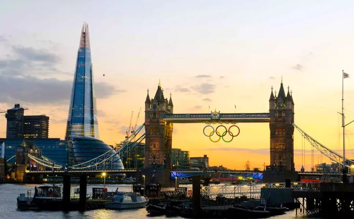 The iconic Tower Bridge and The Shard against a sunset backdrop, captured on the opening day of the 2012 Olympics.