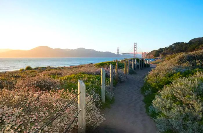 Golden Gate Bridge at sunset viewed from Baker Beach in San Francisco, California.