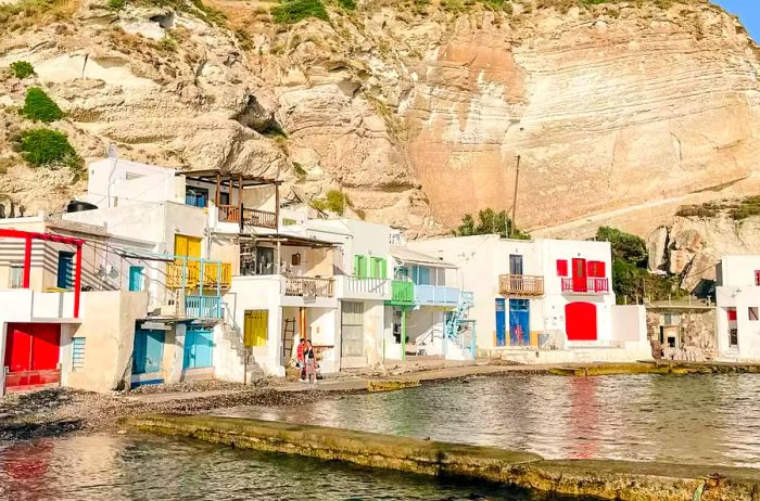 Vibrant buildings lining the shores of Milos