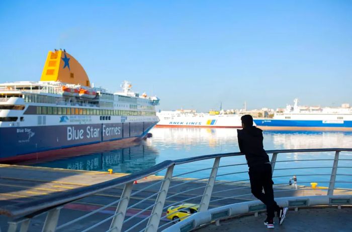 A traveler on a ferry gazing at the waters of Greece