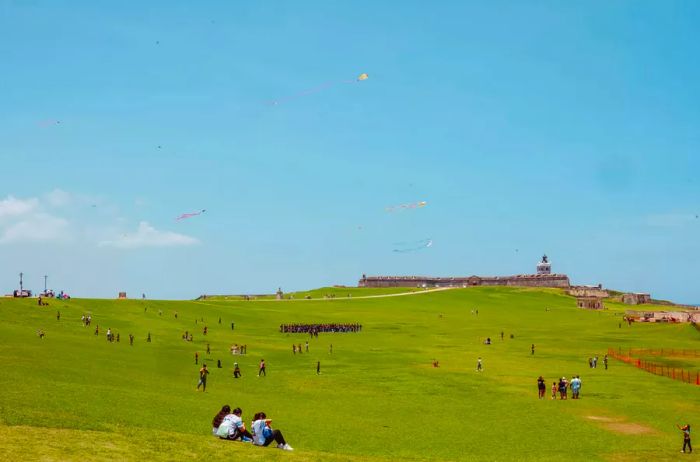 People relaxing on a green lawn in San Juan