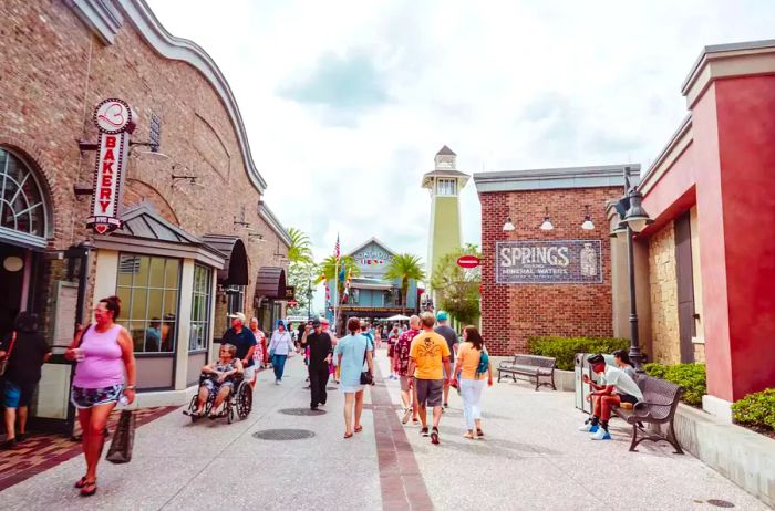 Guests strolling past eateries in Disney Springs