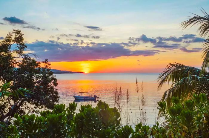 A stunning view of a sunset over the waters of Jamaica