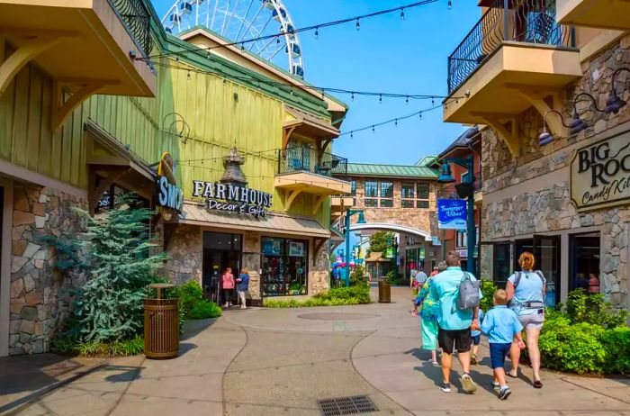 Family strolling through the shopping area of The Island recreation center in Pigeon Forge, Tennessee.