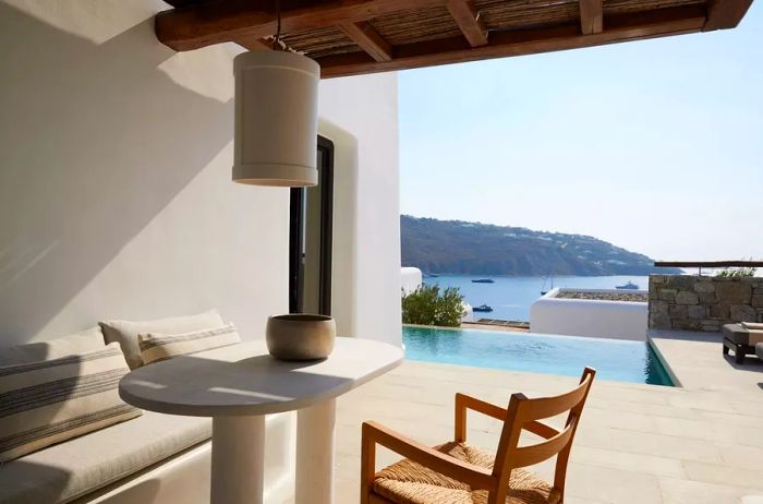 Patio with a view of the pool and the sea