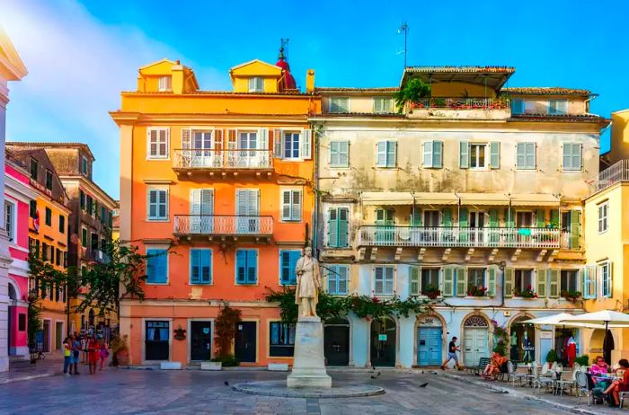 A street view of Kerkyra, the capital of Corfu, Greece, showcasing its beautiful architecture on a sunny summer day. Corfu Island, Greece.