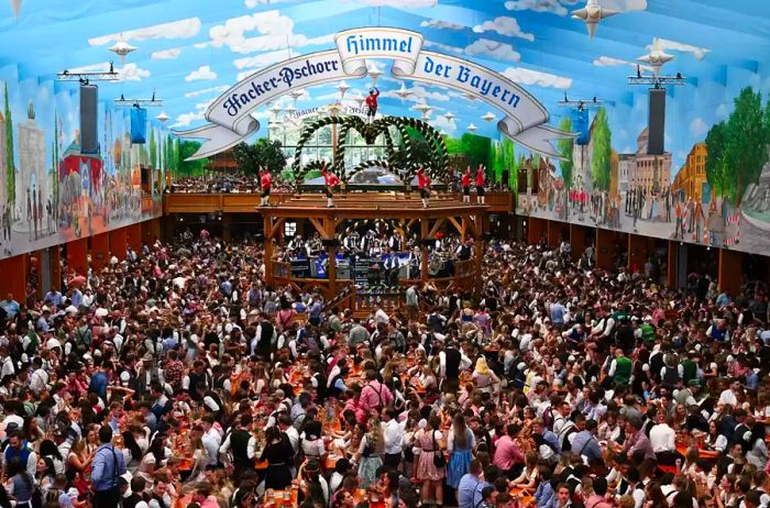 Revellers gather in a festival tent to celebrate the beginning of Oktoberfest.