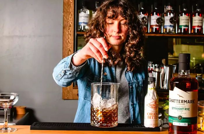 Bartender making a cocktail with Chattermark Whiskey.