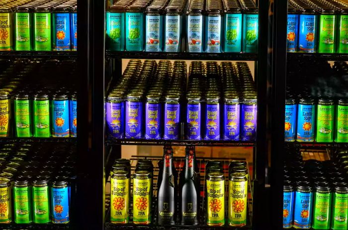 Inside view of a fridge stocked with vibrant beer cans